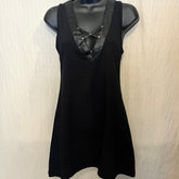 Black minidress with faux leather back details